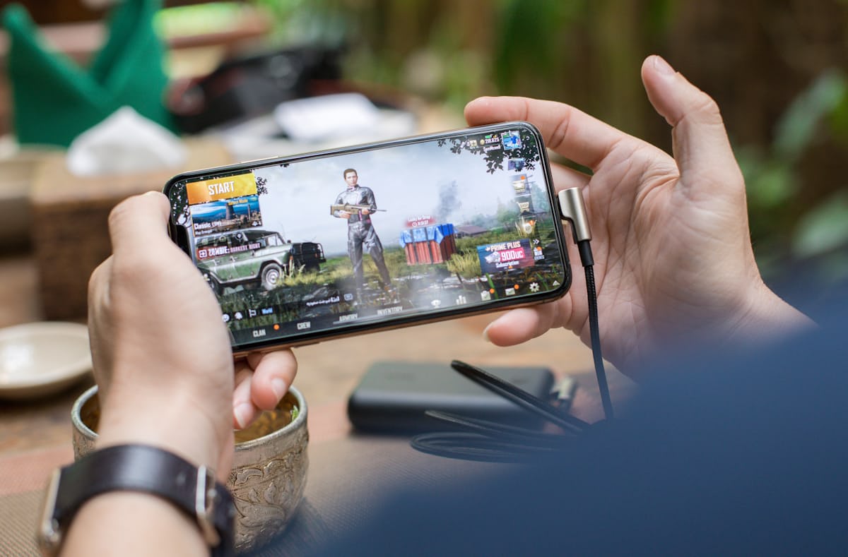 Mobile phone showing a colourful game screenshot