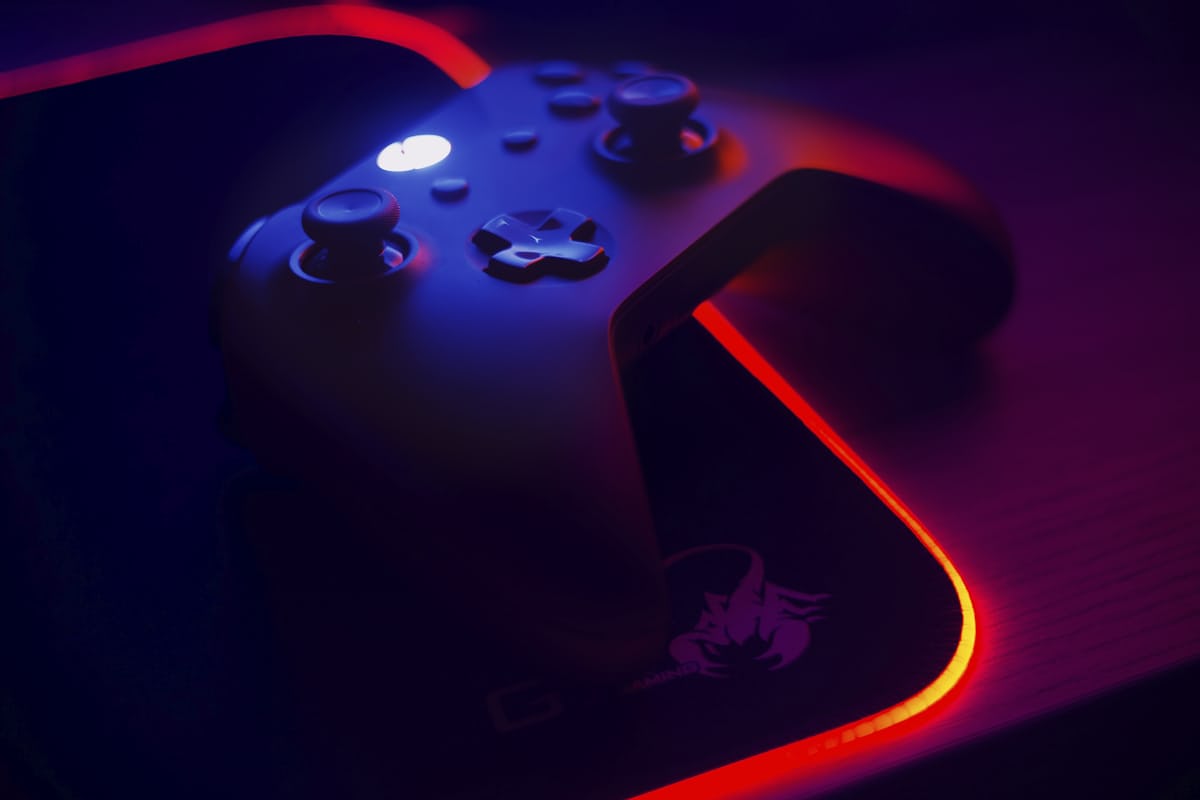 Players at a brightly lit gaming desk