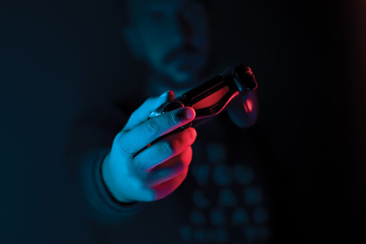 Close-up of hands on a game controller